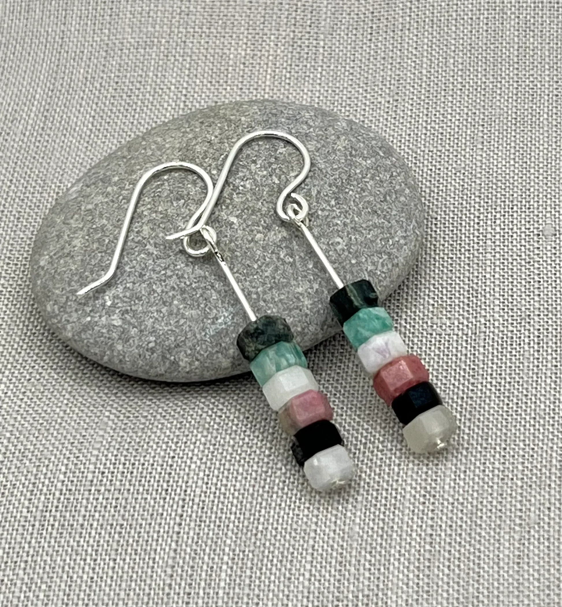 Sterling silver drop earrings with stacked aqua, pink, black, and white gemstone beads